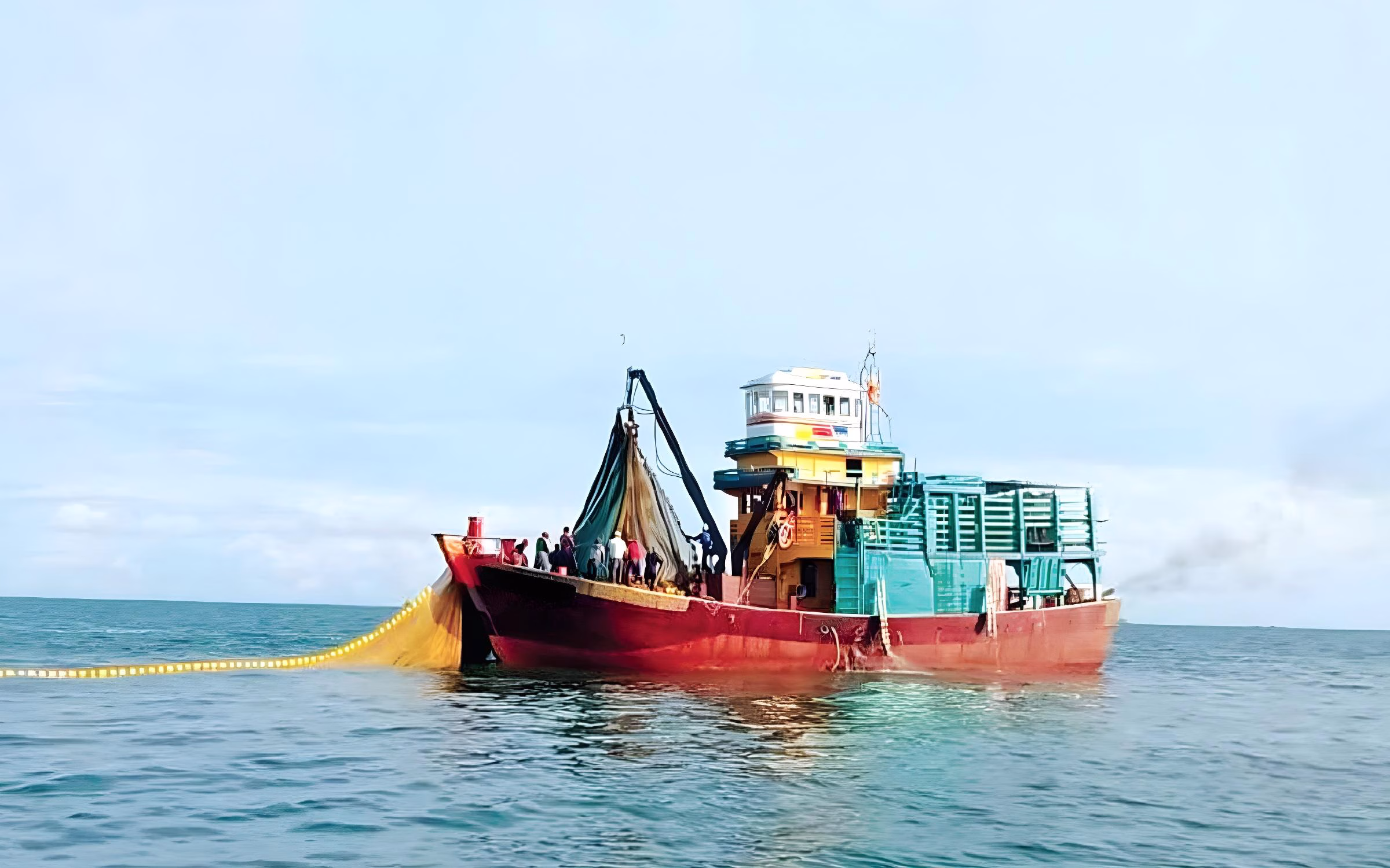 Kapal Ikan Bilis Fishermen harvesting anchovy (ikan bilis) on the ocean in Malaysia